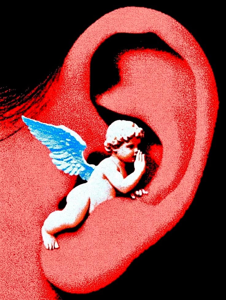 This may contain: an angel figurine sitting in the middle of a pair of ear plugs This may contain: an angel figurine sitting in the middle of a pair of ear plugs