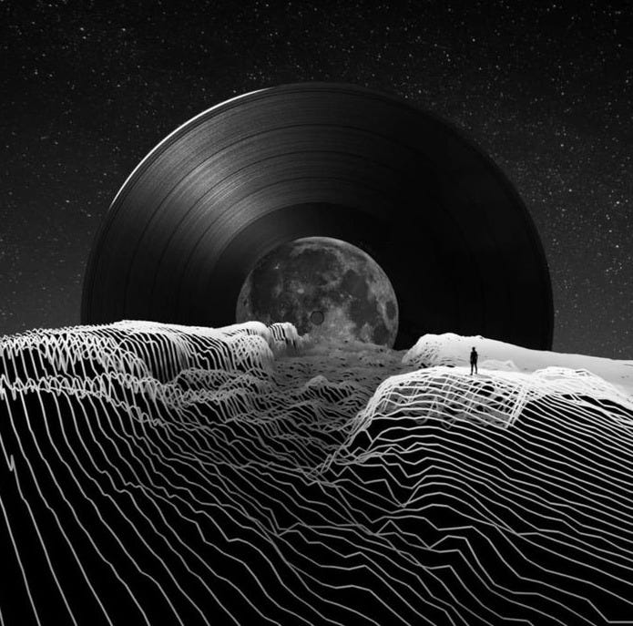 This may contain: a person standing on top of a mountain under a full moon in black and white