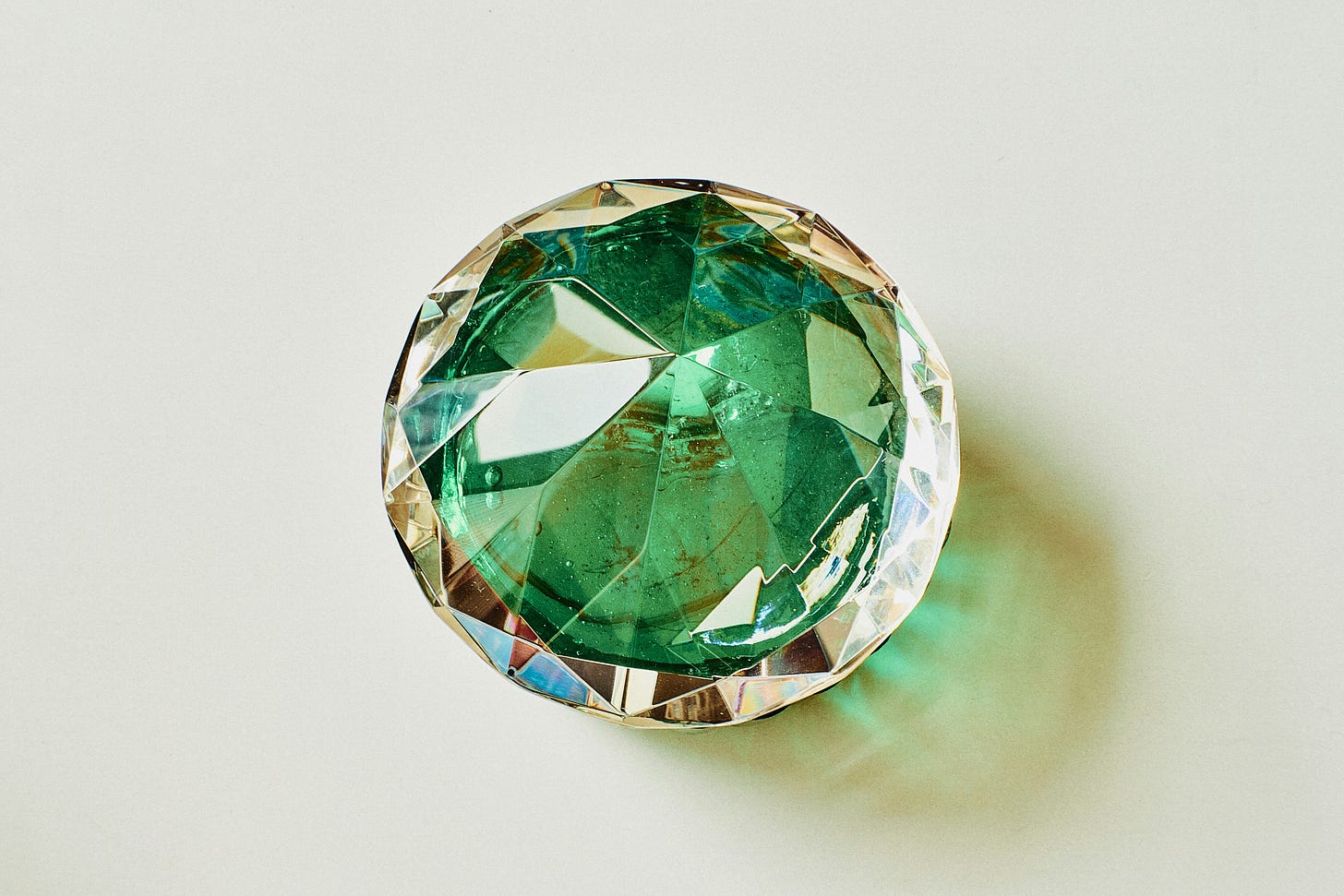 girlwithredhat-unsplash-green gemstone