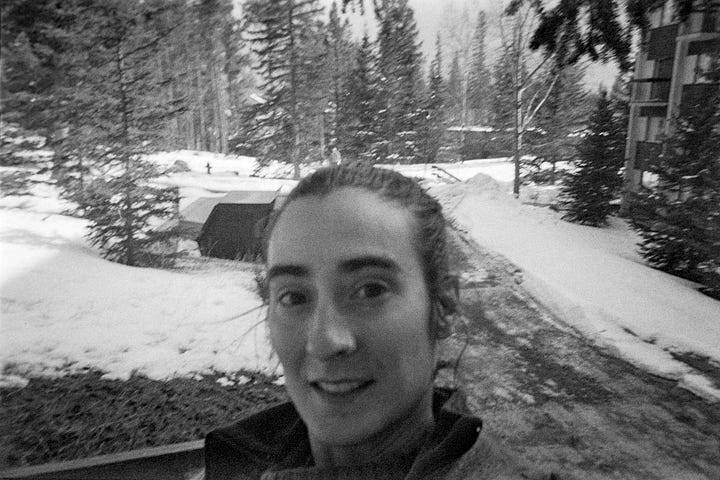 Two pictures of Cecil standing on a snowy road lined with trees and buildings