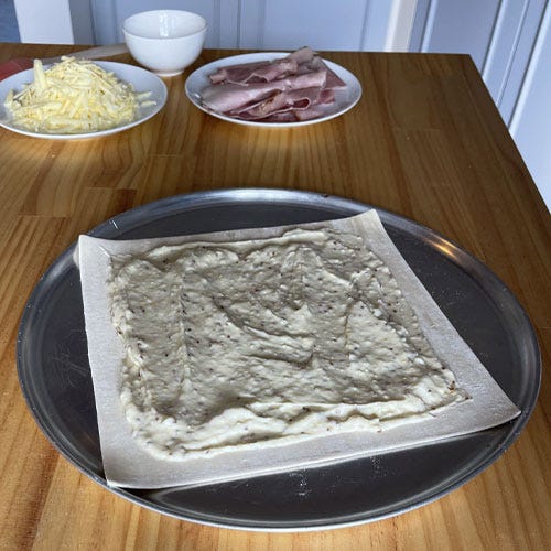 Making of a ham and cheese pie