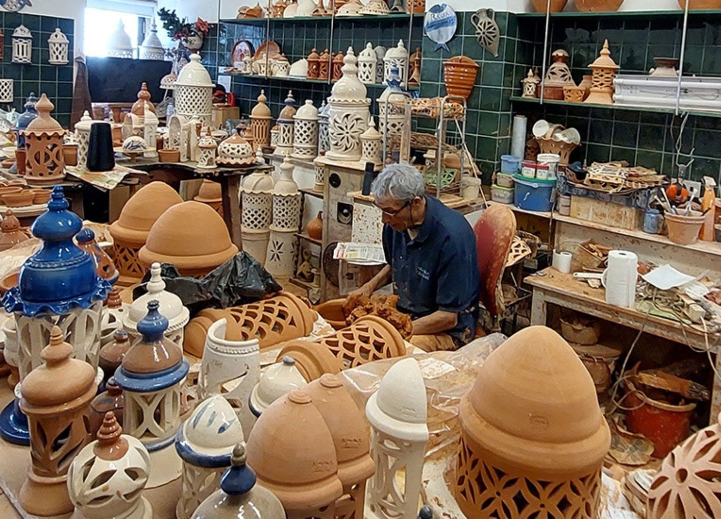 Image of a man in a pottery studio in portugal Image of a man in a pottery studio in portugal