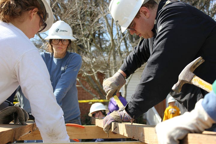 Photo of an anti-Israel demonstration; right, volunteers framing a building
