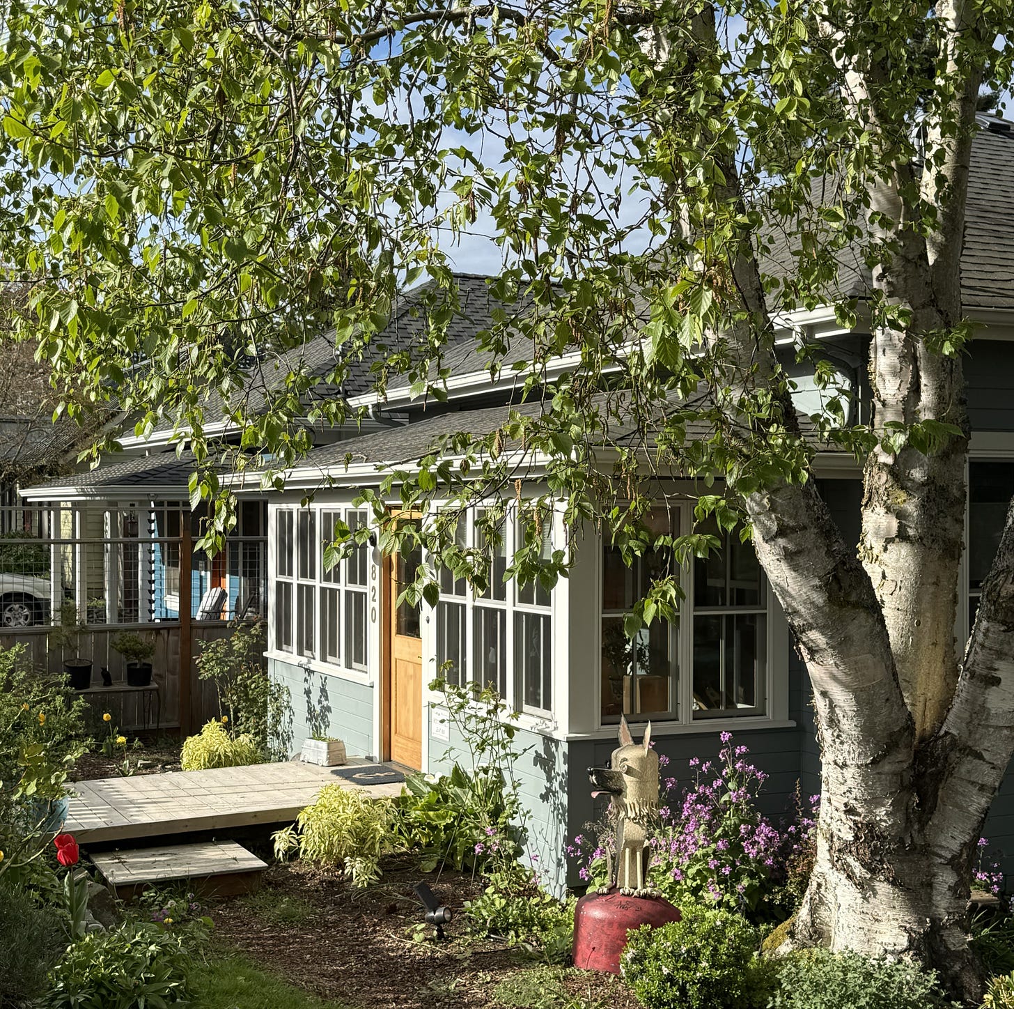 Two single-story cabins, one with an enclosed porch, the other open