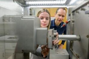 Julie Miller (left) and Matt McCluskey (right) conduct research using the X‑ray beamline at WSU’s Dodgen Research Facility.