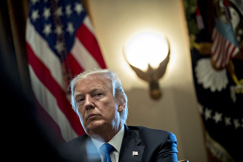 Donald Trump listens during a meeting with bipartisan members of Congress on immigration in the Cabinet Room of the White House.