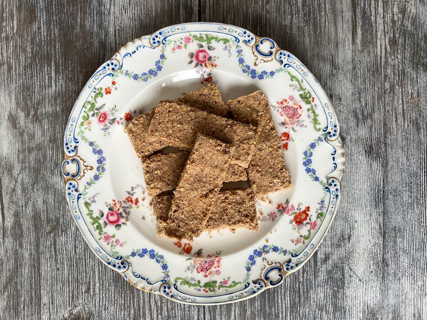 nutty shortbread fingers on a hand painted floral patterned plate