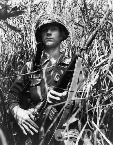 February 1966: Private First Class Ira Rolston of Vian, Oklahoma, holds his rifle as he walks cautiously through a jungle during a drive against the Viet Cong in the Vietnam War, Republic of Vietnam. The operation was from February 3-7, 1966.