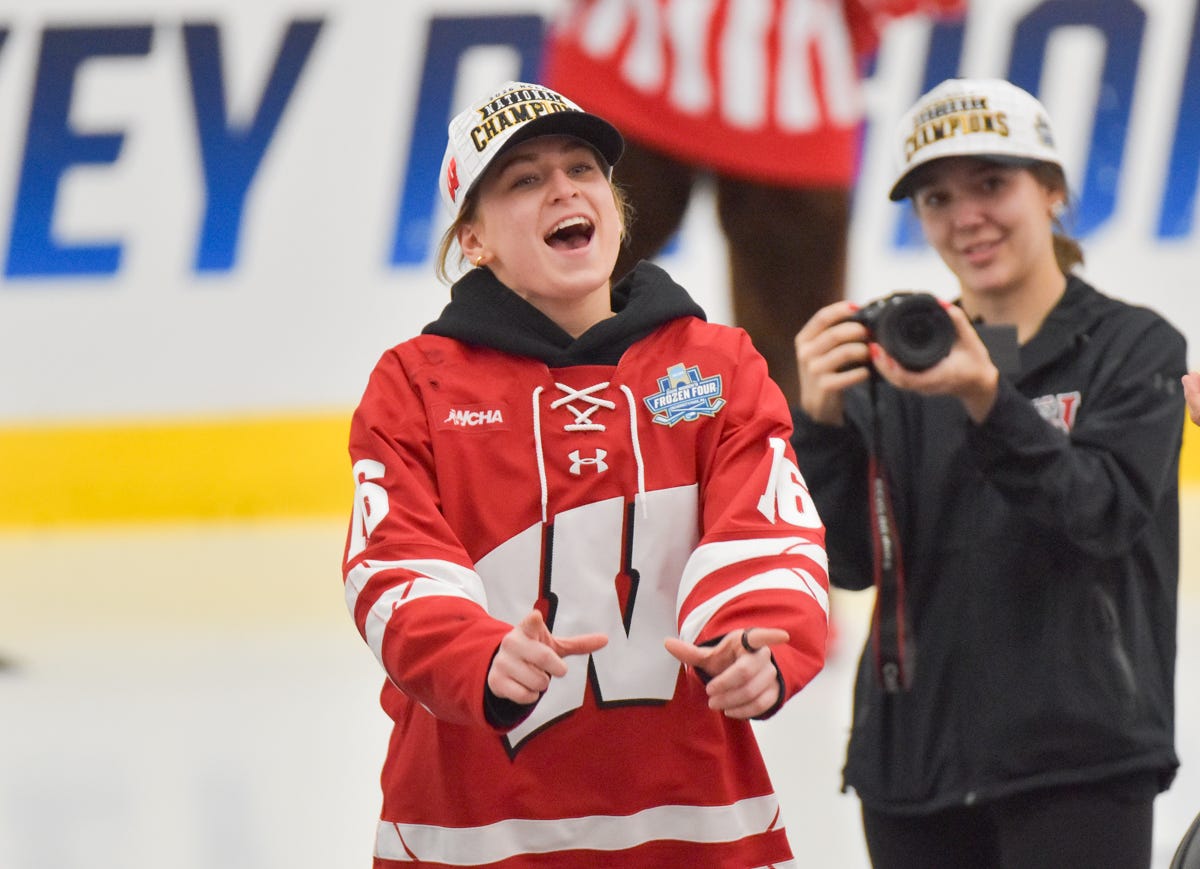 Claire Enright shouting and finishing making a 'w' with her hands