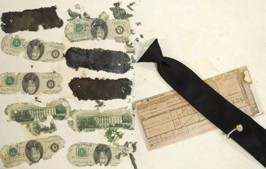 Evidence: Abandoned tie and recovered money.