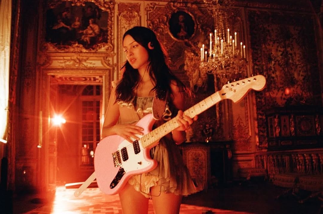Image may contain Guitar Musical Instrument Person Performer Solo Performance Adult Leisure Activities and Music Image may contain Guitar Musical Instrument Person Performer Solo Performance Adult Leisure Activities and Music