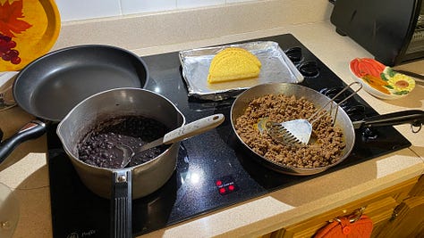 Warm your soft tacos, cook your beef and hard tacos then put it all together.