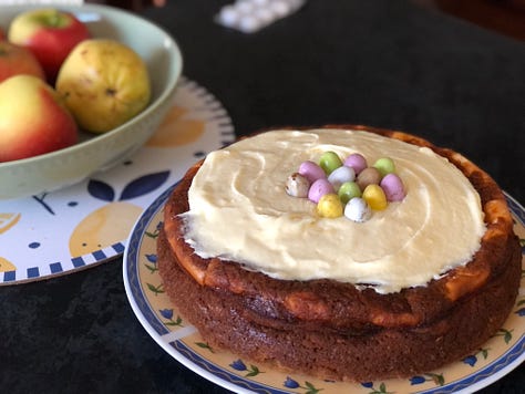 three women having lunch, short woman and tall man, a cheesecake with frosting and easter eggs