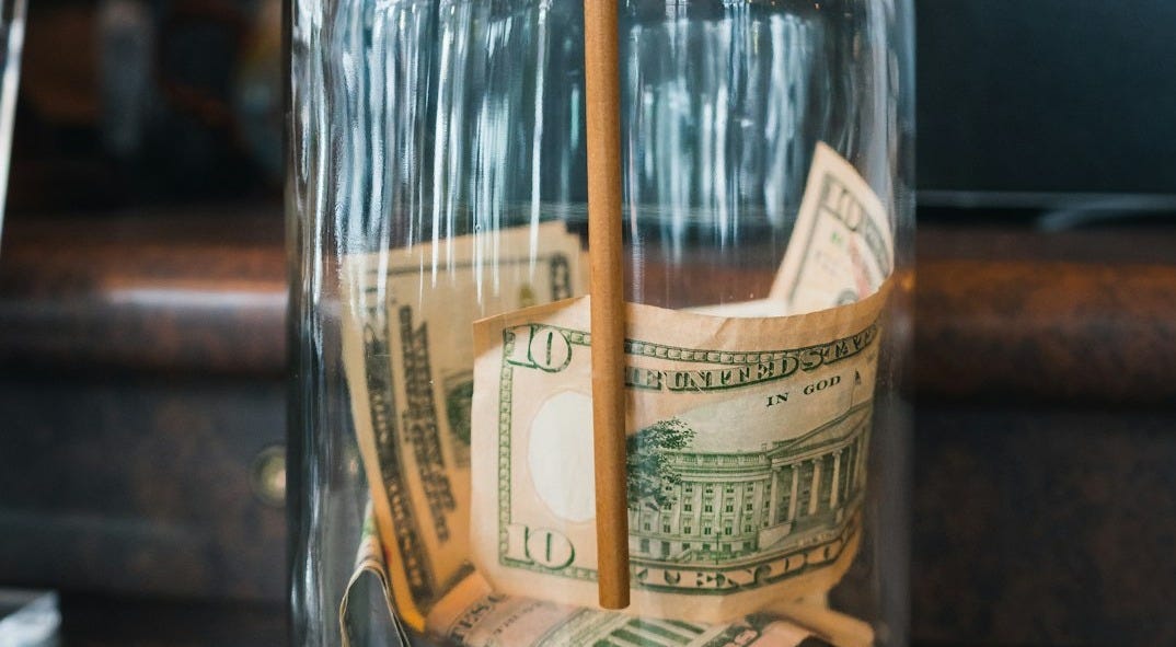 clear glass jar on brown wooden table