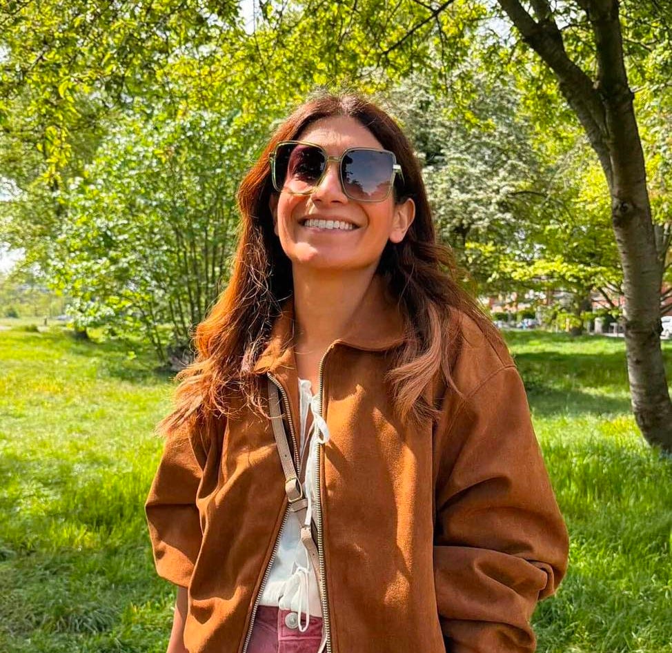 May be an image of smiling