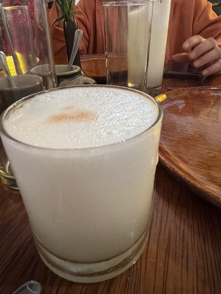 Lomo saltado, seco de res, an appetizer platter for two (armies), pisco sour
