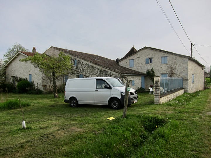 A whtte VW transpoerter van outsode a French Gîte.