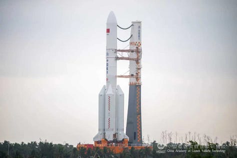 One of the Long March 5's boosters as well as the Y10 vehicle rolling out to and at Launch Complex 101.