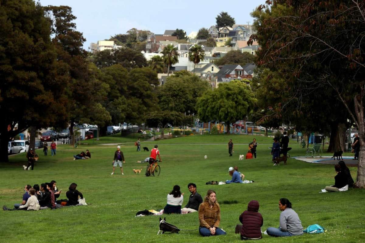People hang out out in Precita Park in Bernal Heights. The district’s population is the same as 10 years ago.