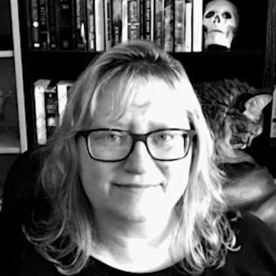 Jade Walker in b&w with her late cat, Brigid