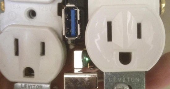 AC outlet with upside-down ground socket