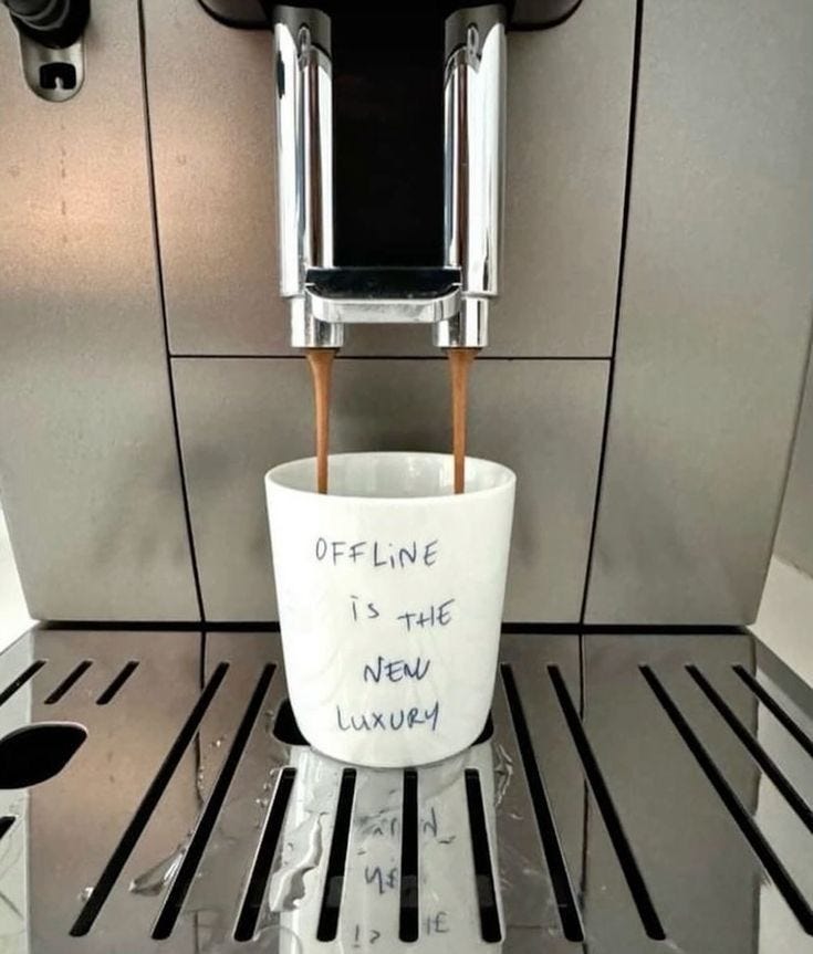 This may contain: a coffee cup that has been placed on the espresso machine for someone to drink