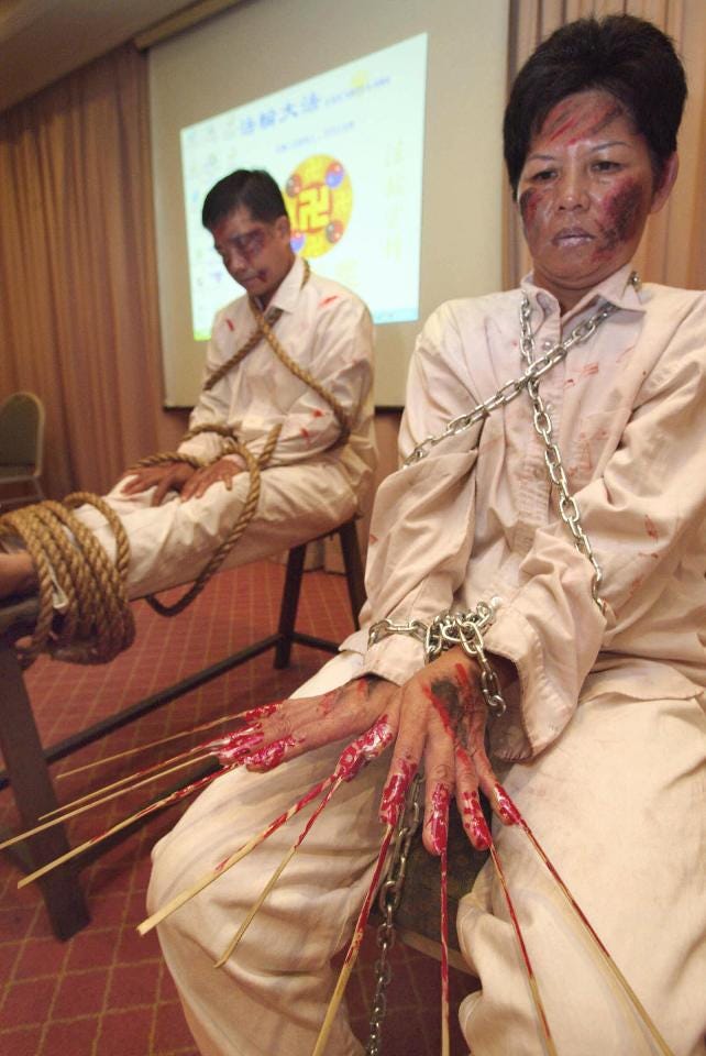 Demonstration of alleged Chinese government torture methods against Falun Gong practitioners. Demonstration of alleged Chinese government torture methods against Falun Gong practitioners.