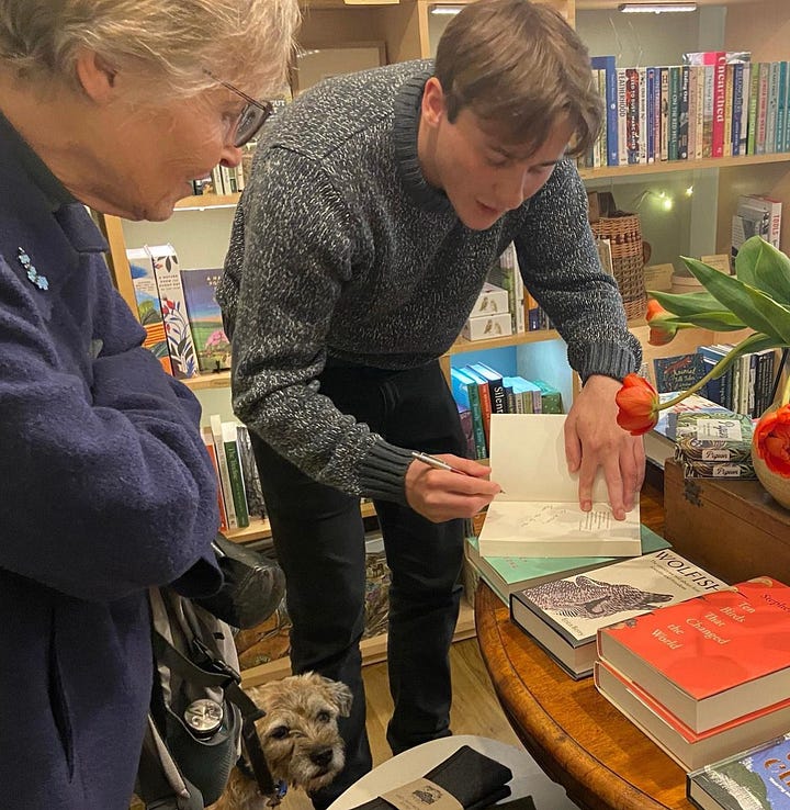 Author Andrew Millham outside Maldon Books with his book and dog (left). Andrew signing a copy of his book for a reader in Folde Books (right)