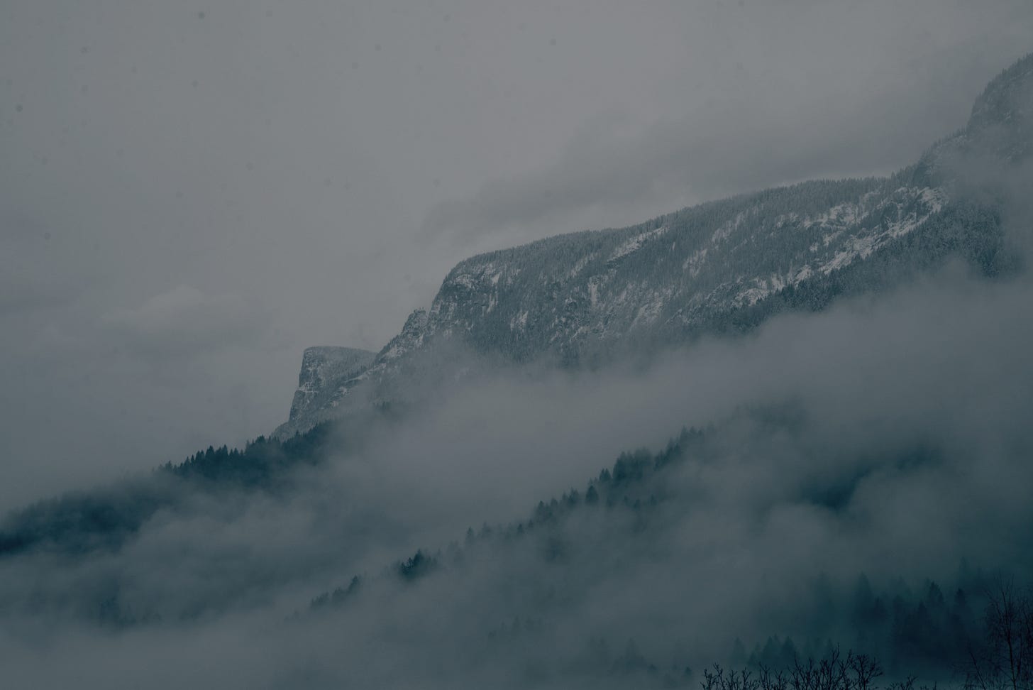 Mountains with fog, painting a gloomy and still atmosphere Mountains with fog, painting a gloomy and still atmosphere