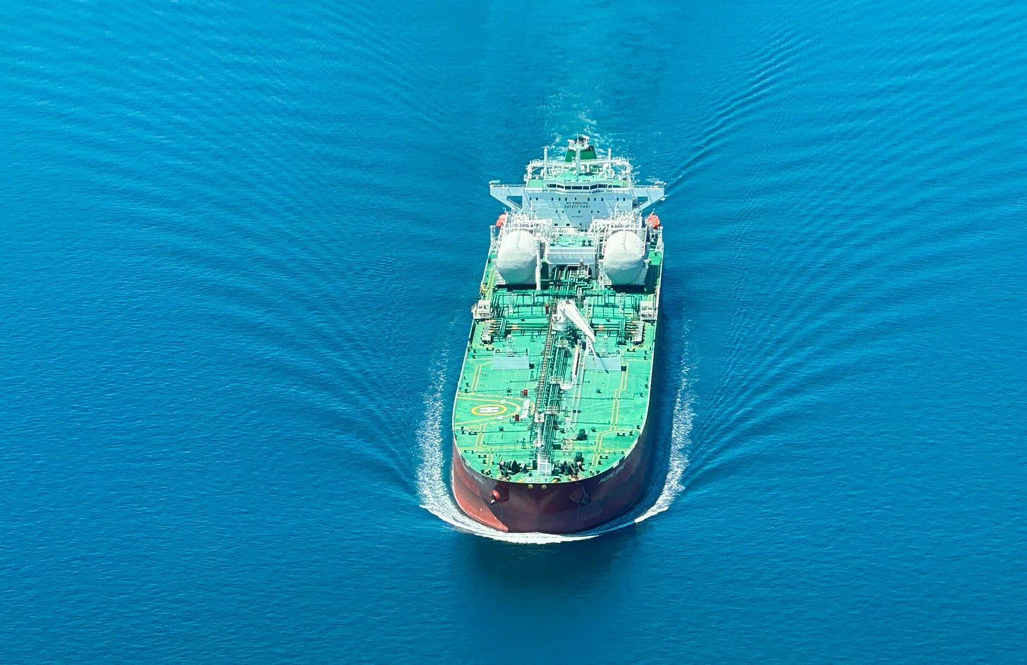 a large cargo ship in the middle of the ocean