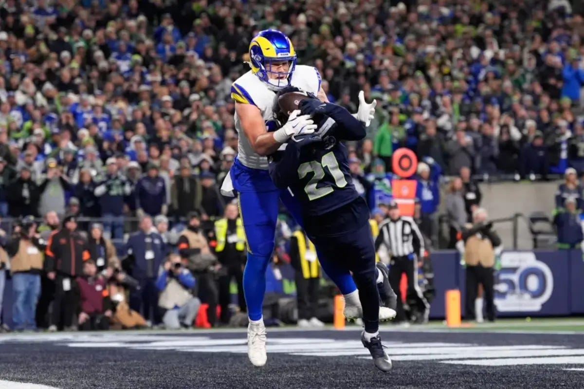 Seattle Seahawks cornerback Devon Witherspoon breaks up fourth-and-goal pass intended for Rams tight end in end zone during NFC Championship