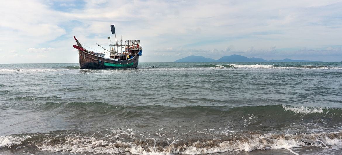 A boat carrying Rohingya refugees is anchored offshore in the Andaman Sea near Aceh, Indonesia. A boat carrying Rohingya refugees is anchored offshore in the Andaman Sea near Aceh, Indonesia.