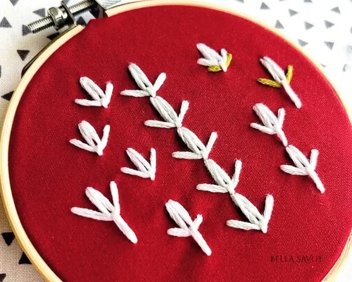 Cute Tulip Stitch Tutorial 101 red hooped fabric with the tulip stitch in various groupings
