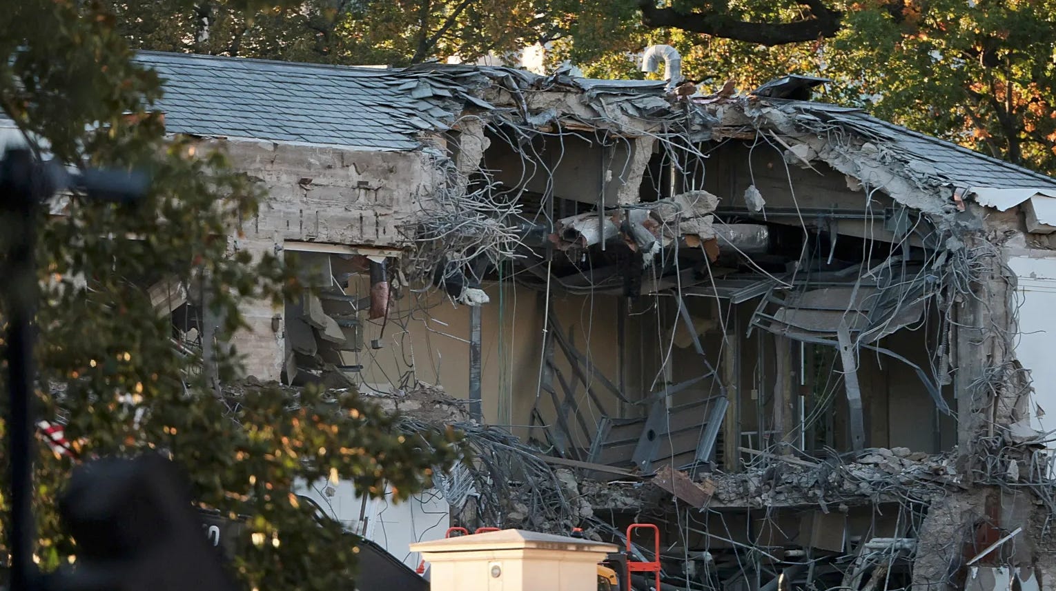 Photo of White House East Wing torn off, demolition in progress.