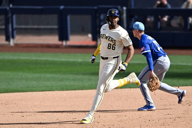 Ernesto Martinez of the Milwaukee Brewers runs out a double during the sixth inning of a spring training game against the Kansas City Royals at...