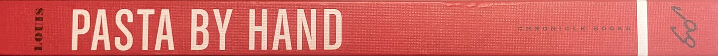 Book spine of Pasta by Hand by Jenn Louis, in red with white text.