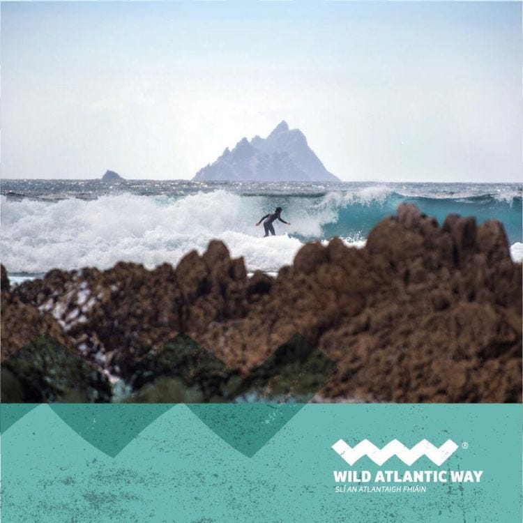 Wild Atlantic Way Irish coastline, someone surfing Wild Atlantic Way Irish coastline, someone surfing