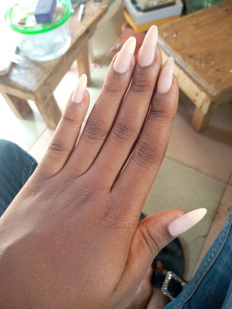 6 Images of fingers with different nail polish.