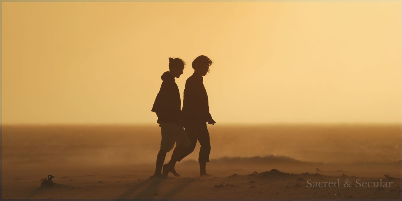 Silhouettes of two people walking together along a beach at sunset, symbolising thoughtful conversation, shared journey and faith that grows through relationship rather than argument. Silhouettes of two people walking together along a beach at sunset, symbolising thoughtful conversation, shared journey and faith that grows through relationship rather than argument.