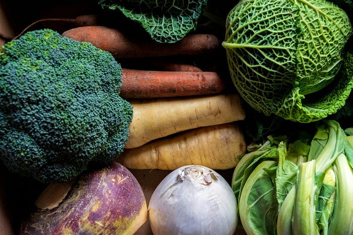 A pile of vegetables like carrots, broccoli, cabbage and turnip. A pile of vegetables like carrots, broccoli, cabbage and turnip.