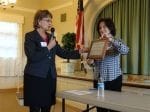 Susan and Carol present Ruth Rollins with a framed appreciation plaque