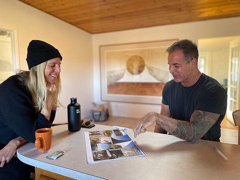 One row of three photos, left to right: Photo of a man with a model sculpture of a house positioning it over architectural blueprint designs; Photo of man sitting and woman standing at a kitchen high-top counter, smiling as he points and describes printed copies of architectural designs and inspiration boards, in a high-ceilinged room with framed abstract art in the background; Photo of a man standing outside near the window, seen through two rooms, including one with an original interior front door and another of a living room with large windows.