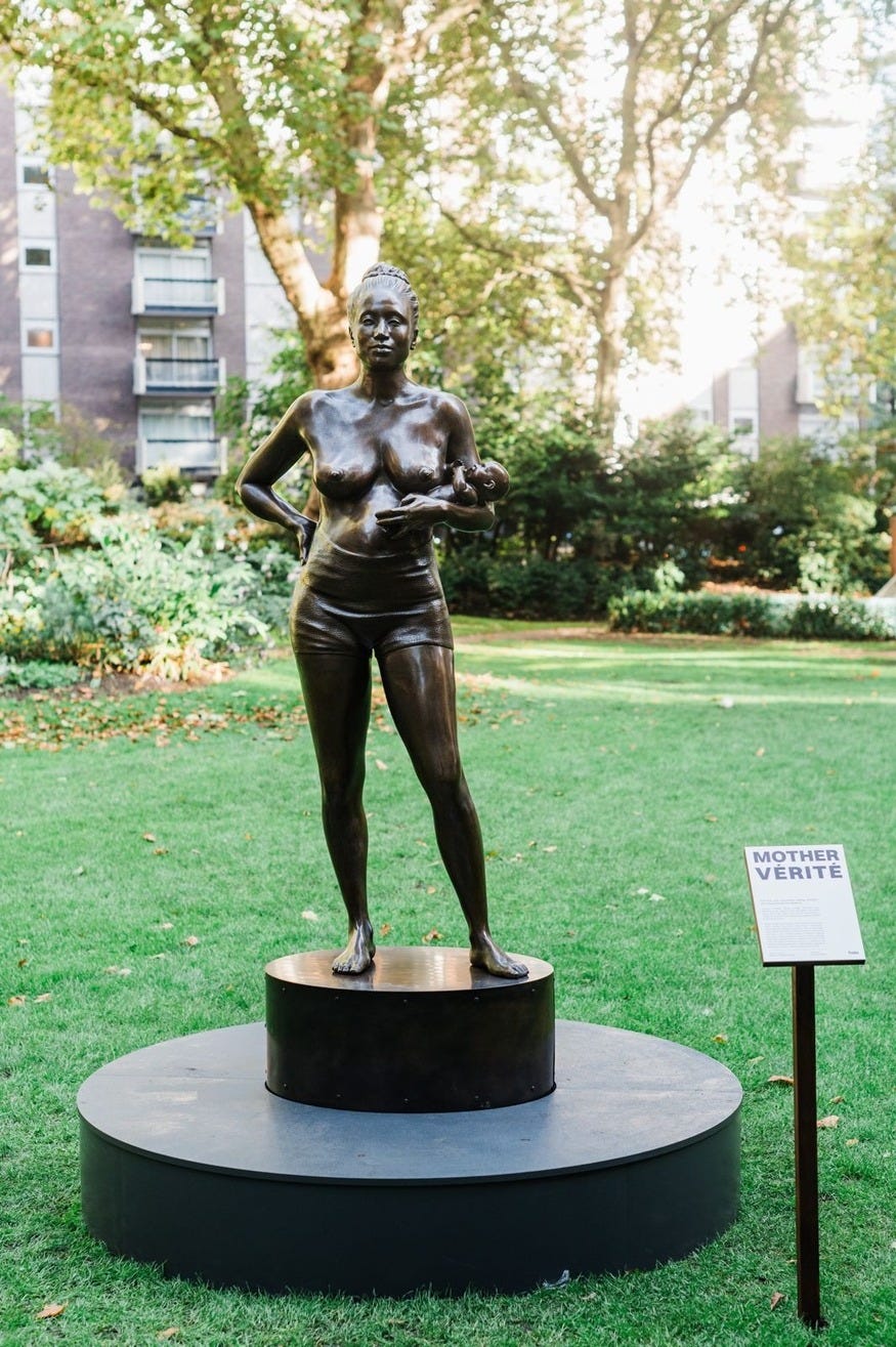 Statue of a woman with her baby Statue of a woman with her baby