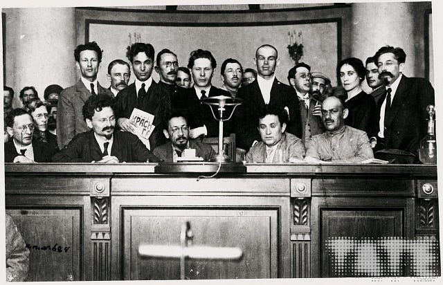 A meeting of Sovnarcom (Council of People's Commissars) in Petrograd, early  1918 (l to r) Moisei Uritsky, Loan Trotsky, Yakov Sverdlov, Grigorii  Zinoviev and Mikhail Lashevich., unknown, 1918 | Tate Images