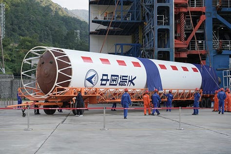The Long March 2D 100th first-stage, second-stage, and fairing heading to and being placed onto Launch Complex 3.