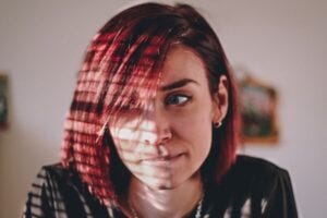 Woman looking pensive. Courtesy of University of Arizona.