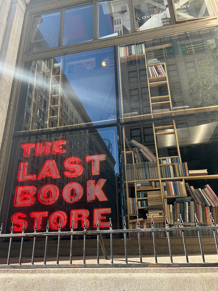 the last bookstore's sign and book arch