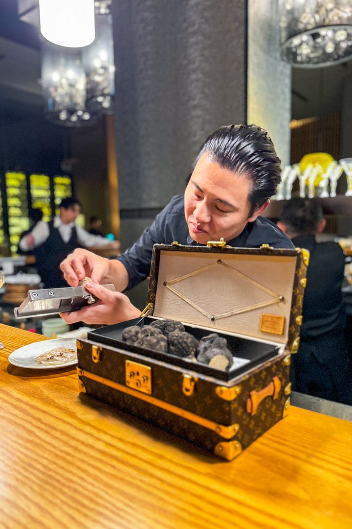 Chef Taka shaving summer truffles over shiromi white fish; uni with caviar and beef collagen and the beef stew in tomato sauce