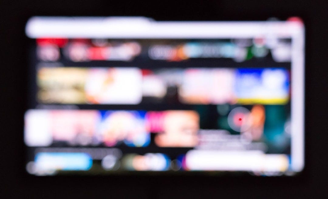 a remote control sitting in front of a television
