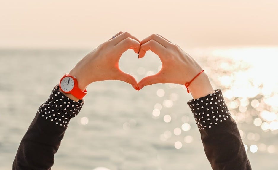 person in black long sleeve shirt with black and white polka dot bracelet person in black long sleeve shirt with black and white polka dot bracelet